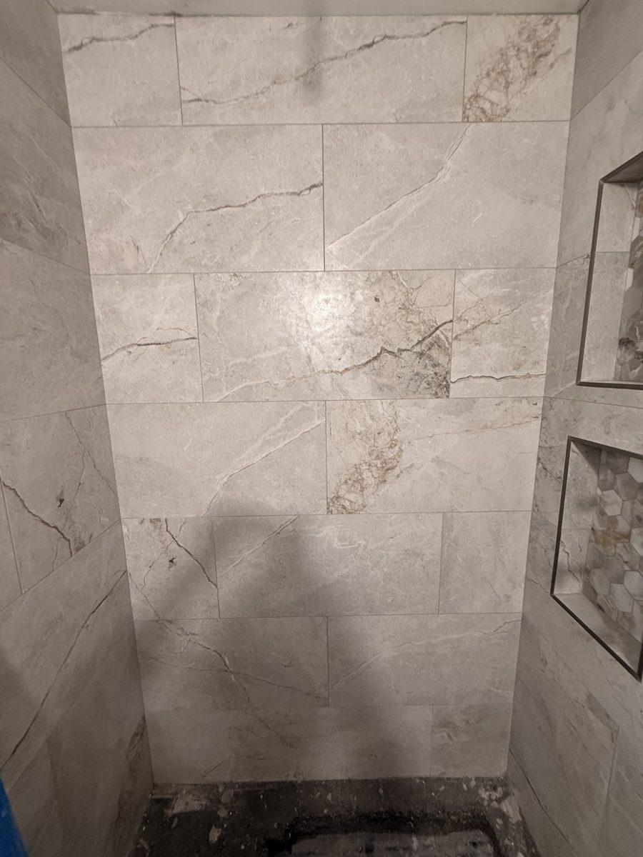 Tiled shower with niches and fixtures