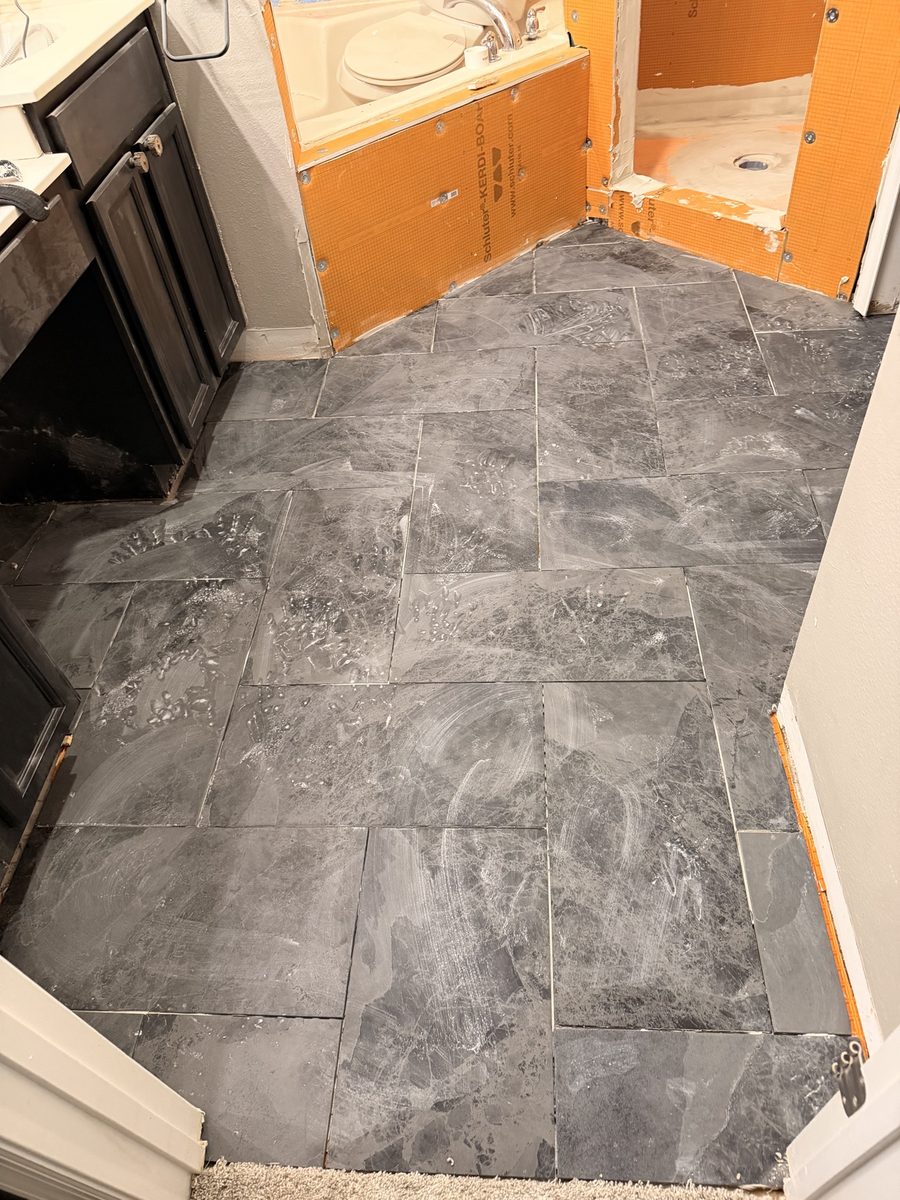 Bathroom slate tile floor and tub