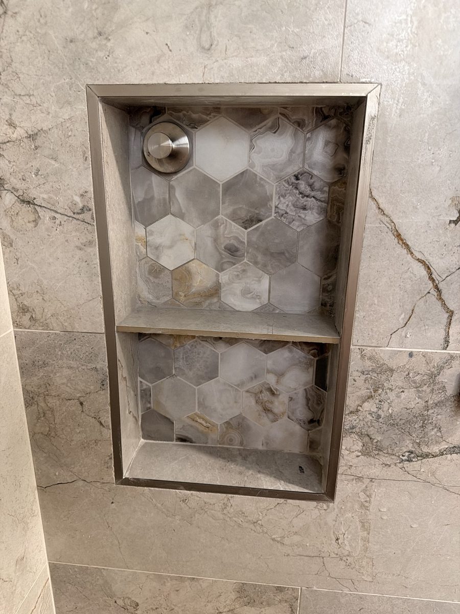 Shower niche with hexagon tile