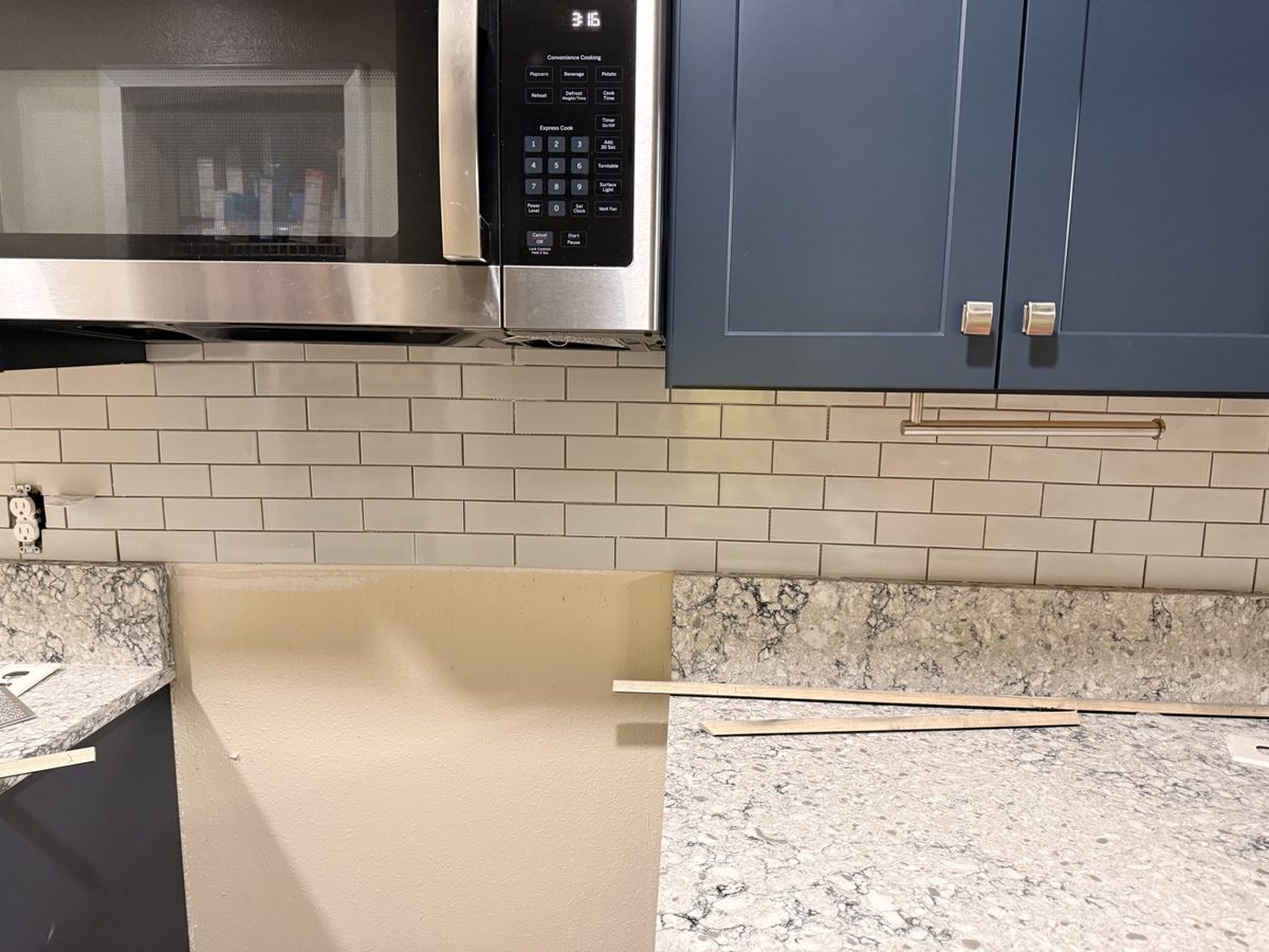 Subway tile kitchen backsplash with microwave