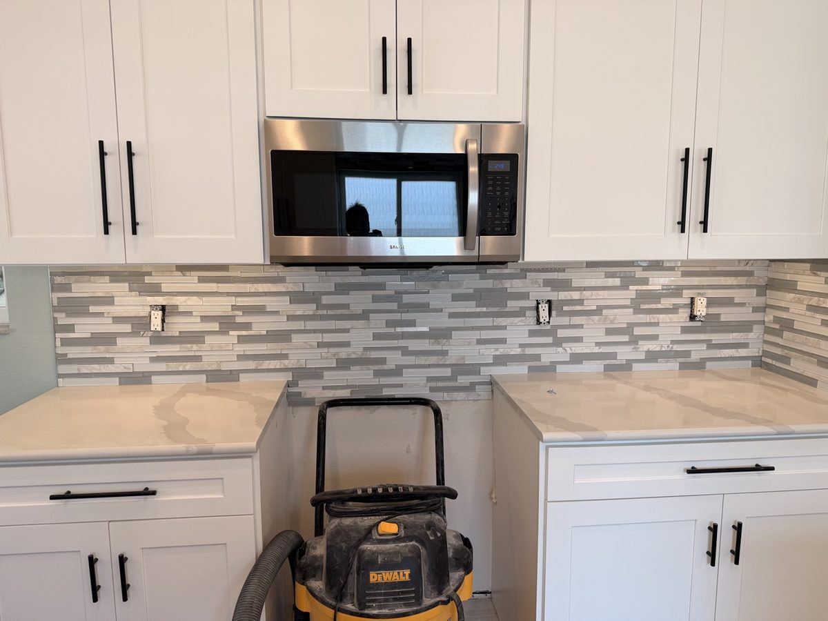 Kitchen remodel with new backsplash