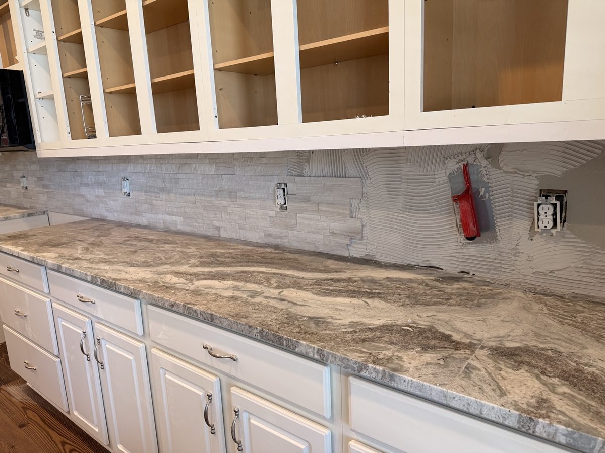 Backsplash tile installation in progress