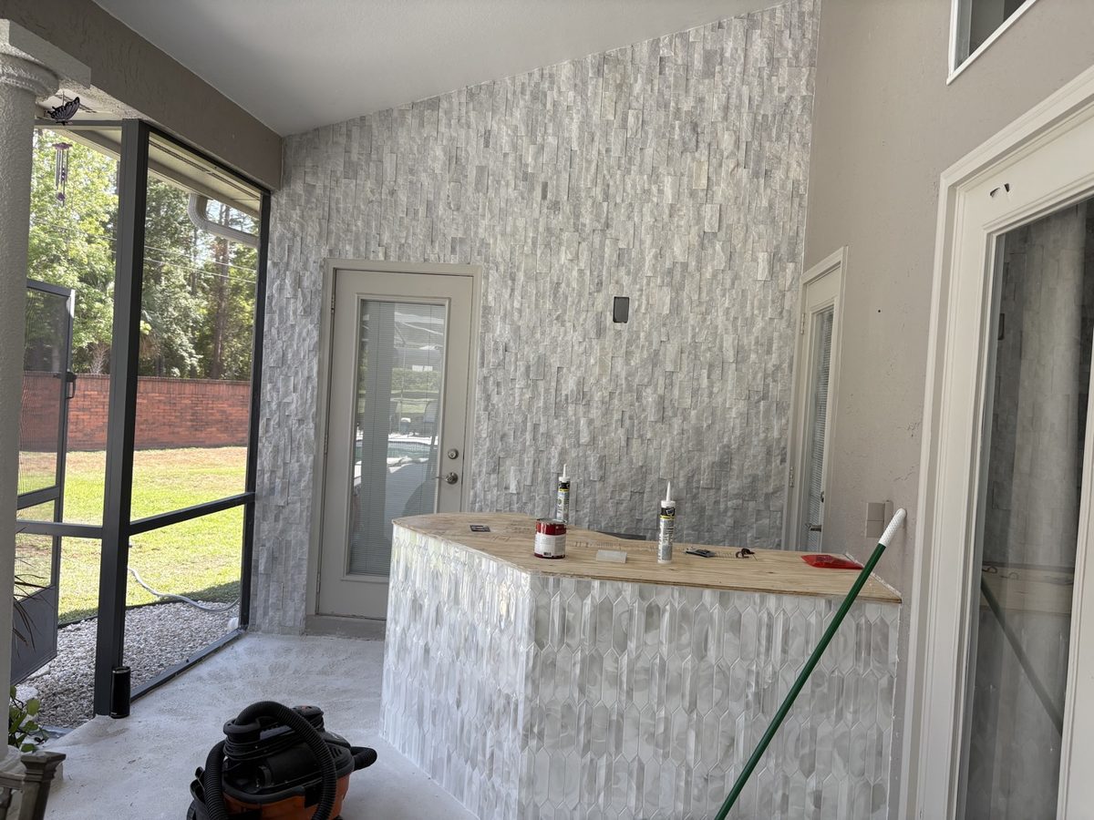 Outdoor stacked stone wall and tile bar